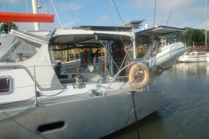 Slide: The Image of Sailing yacht Garcia 48 Raised Salon 2000 docked with lifebuoy and equipment visible. - 9