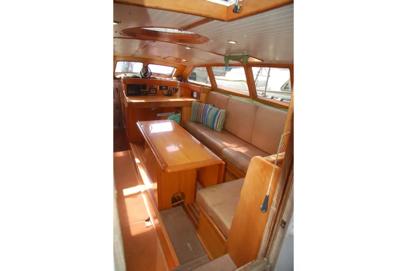 Slide: The Image of Interior of 2000 Garcia 48 Raised Salon yacht with wooden furnishings and seating area. - 51
