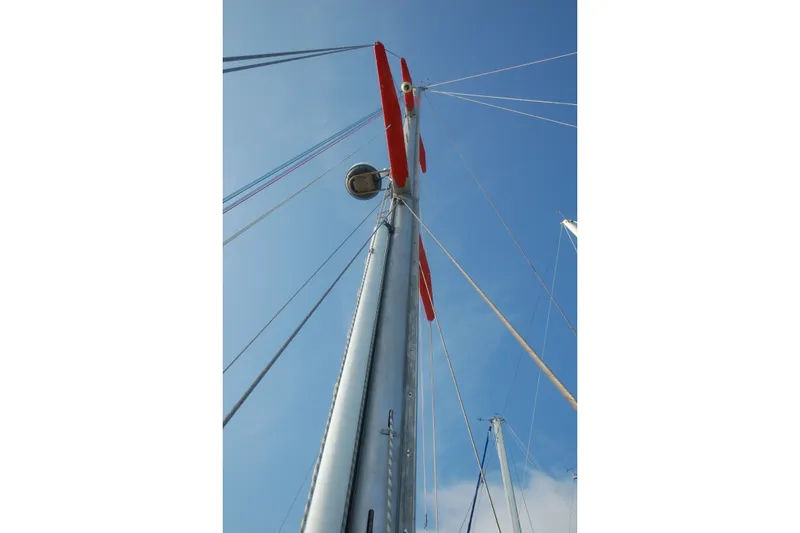Slide: The Image of Mast of 2000 Garcia 48 Raised Salon sailboat against clear blue sky. - 25