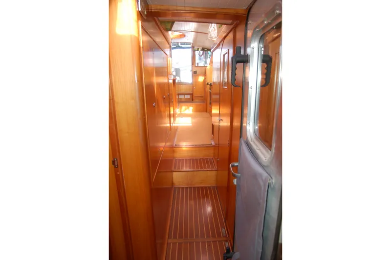 Slide: The Image of Interior hallway of 2000 Garcia 48 Raised Salon yacht with wooden paneling. - 75