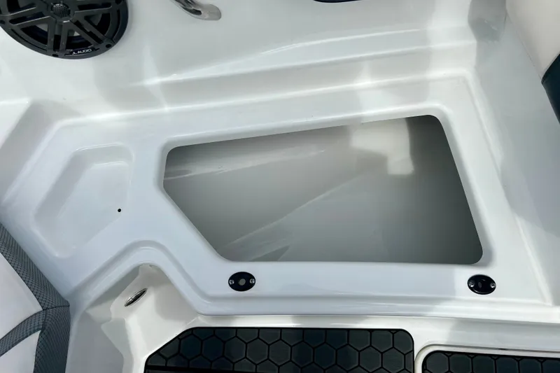 Slide: The Image of Interior view of 2022 Scarab 215 ID boat with speaker and storage compartment. - 43