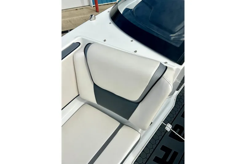 Slide: The Image of 2022 Scarab 215 ID boat interior with white and gray seating detail. - 56