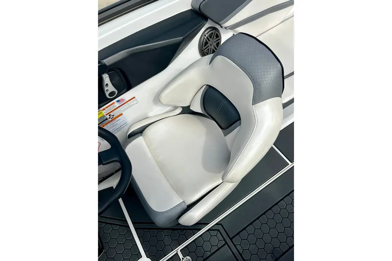 Slide: The Image of Captain's seat of 2022 Scarab 215 ID boat, featuring sleek design and premium materials. - 30