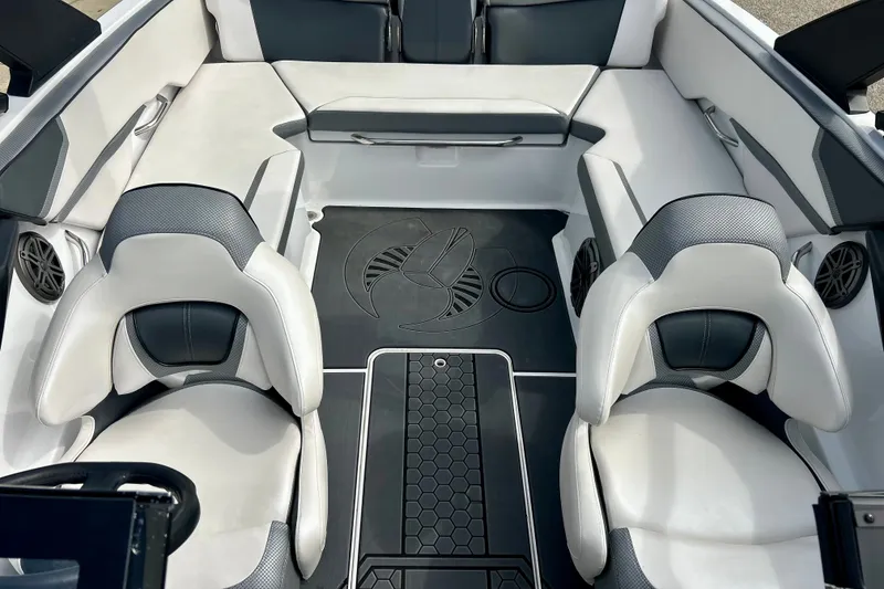 Slide: The Image of Interior of 2022 Scarab 215 ID boat with modern seating and sleek design. - 51