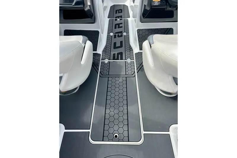 Slide: The Image of Interior of 2022 Scarab 215 ID boat with sleek seating and hexagonal floor design. - 46