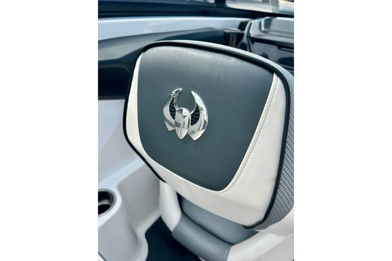 Slide: The Image of 2022 Scarab 215 ID boat seat with logo, featuring sleek black and white design. - 50