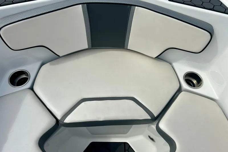 Slide: The Image of 2022 Scarab 215 ID boat interior with cushioned seating and cup holders. - 40