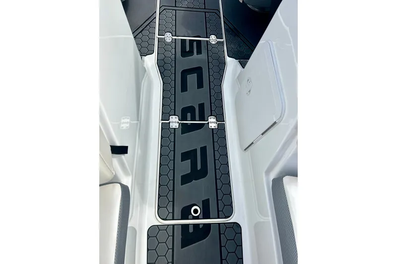 Slide: The Image of 2022 Scarab 215 ID boat interior with hexagonal pattern flooring. - 44