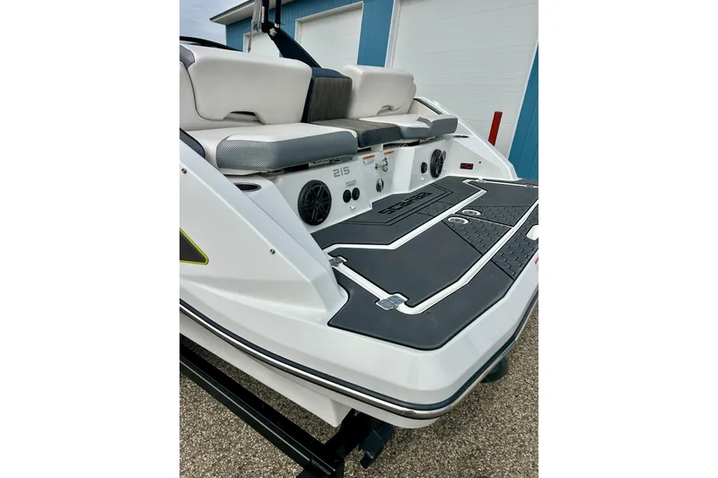 Slide: The Image of 2022 Scarab 215 ID boat rear view with seating and deck details. - 13