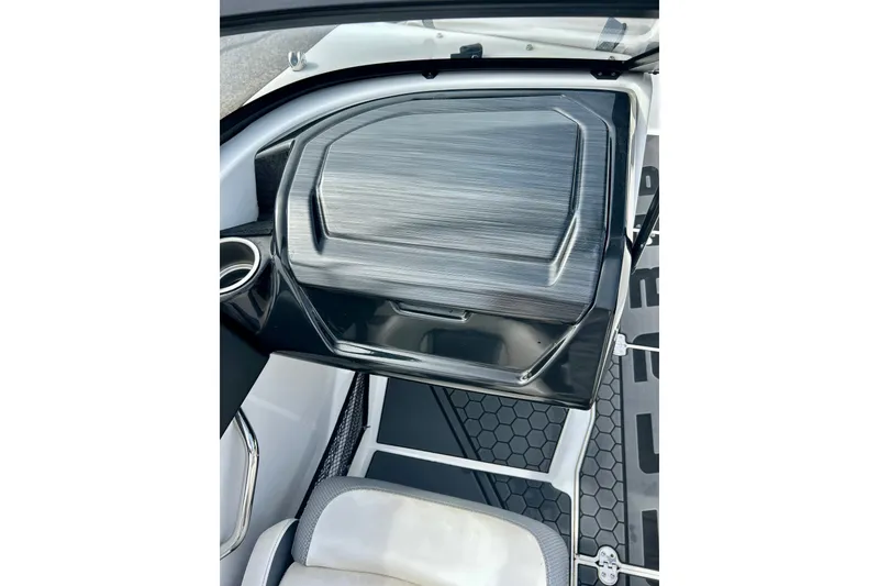 Slide: The Image of Interior view of 2022 Scarab 215 ID boat, featuring sleek dashboard design. - 36