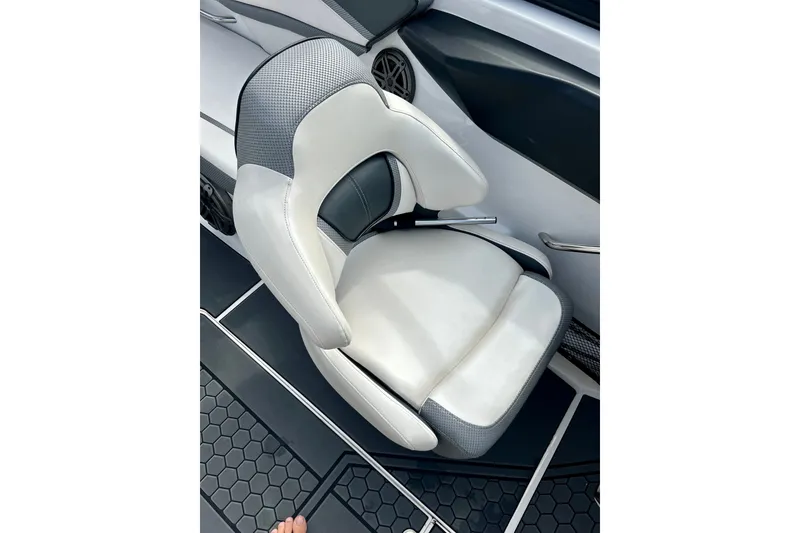 Slide: The Image of 2022 Scarab 215 ID boat seat with sleek white and gray design. - 32