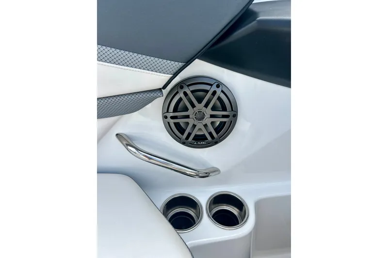 Slide: The Image of 2022 Scarab 215 ID boat interior with speaker, handle, and cup holders. - 49