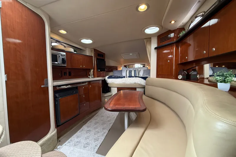 Slide: The Image of Luxurious interior of a 2006 Sea Ray Sundancer 320 yacht with elegant wood finishes. - 25