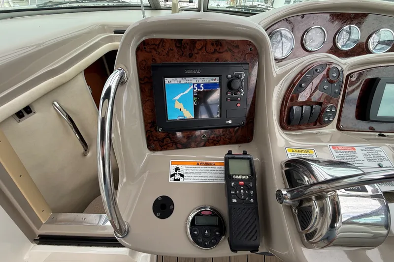 Slide: The Image of Control panel of a 2006 Sea Ray Sundancer 320 with navigation system and controls. - 19