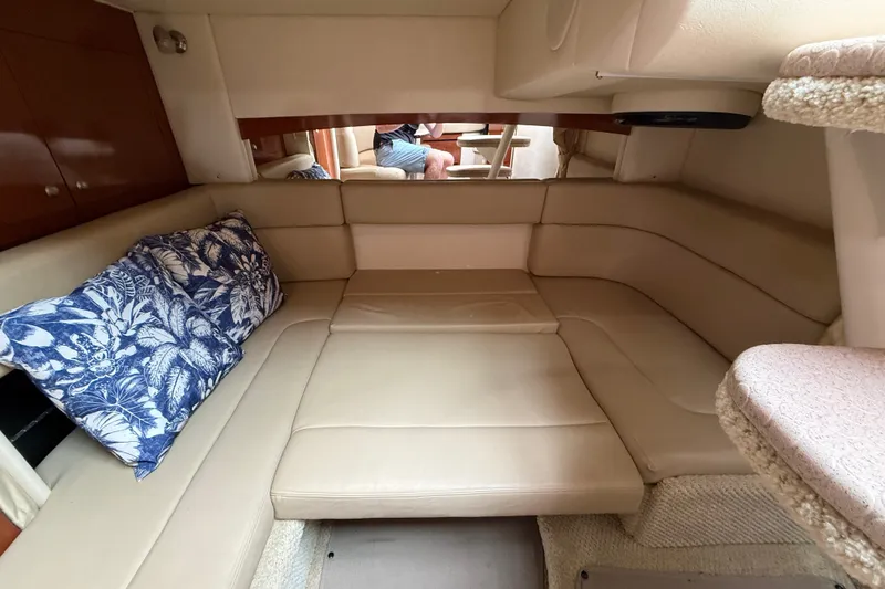 Slide: The Image of Interior of 2006 Sea Ray Sundancer 320 with beige seating and floral cushions. - 43