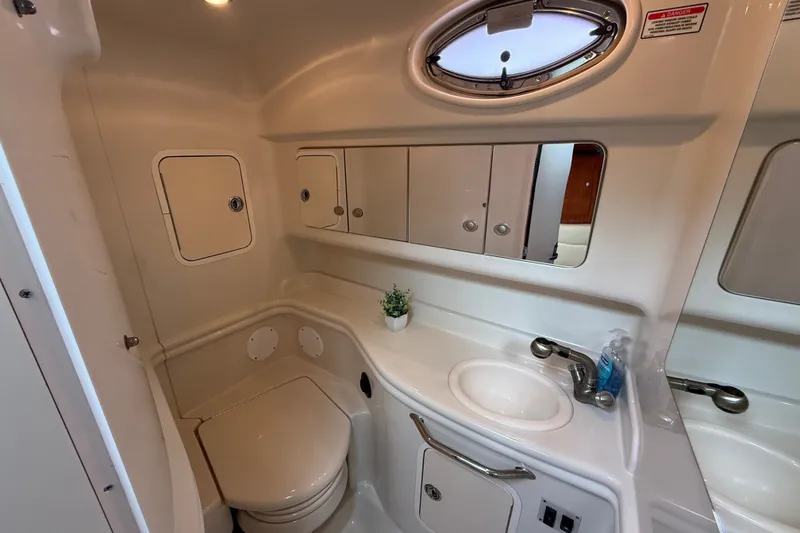Slide: The Image of Bathroom interior of 2006 Sea Ray Sundancer 320 yacht, featuring sink and toilet. - 46