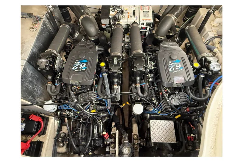 Slide: The Image of Engine compartment of a 2006 Sea Ray Sundancer 320, featuring dual MerCruiser 6.2 MPI engines. - 50