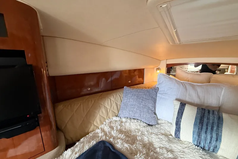 Slide: The Image of Interior cabin of 2006 Sea Ray Sundancer 320 with cozy bedding and pillows. - 37