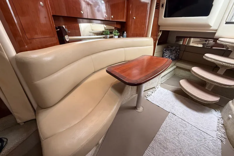Slide: The Image of Interior of 2006 Sea Ray Sundancer 320 with beige seating and wooden table. - 41