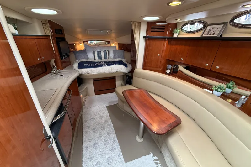 Slide: The Image of Luxurious interior of a 2006 Sea Ray Sundancer 320 yacht with elegant wood finishes. - 24