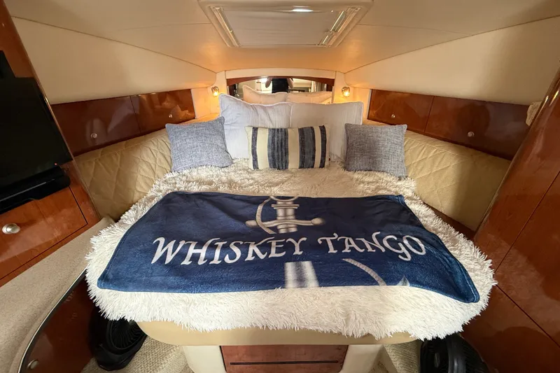 Slide: The Image of Luxurious cabin interior of 2006 Sea Ray Sundancer 320 with cozy bedding. - 35