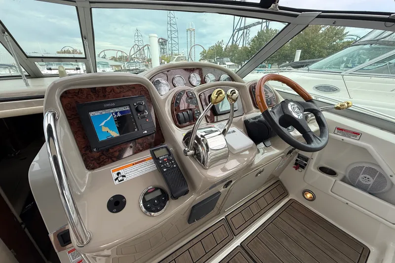 Slide: The Image of Helm of 2006 Sea Ray Sundancer 320 with navigation system and wooden steering wheel. - 17