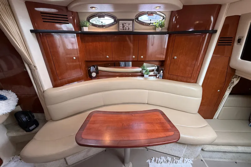 Slide: The Image of Interior of 2006 Sea Ray Sundancer 320 with elegant wood cabinetry and beige seating. - 26