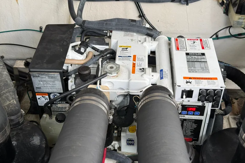 Slide: The Image of Engine compartment of a 2006 Sea Ray Sundancer 320 with Kohler generator. - 53