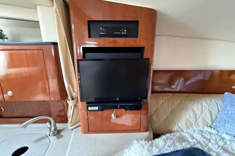 Slide: The Image of Interior of 2006 Sea Ray Sundancer 320 with TV and wooden cabinetry. - 36