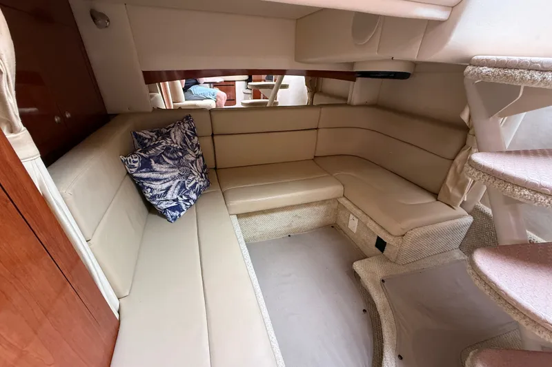 Slide: The Image of Luxurious interior of 2006 Sea Ray Sundancer 320 with beige seating and decorative pillow. - 42
