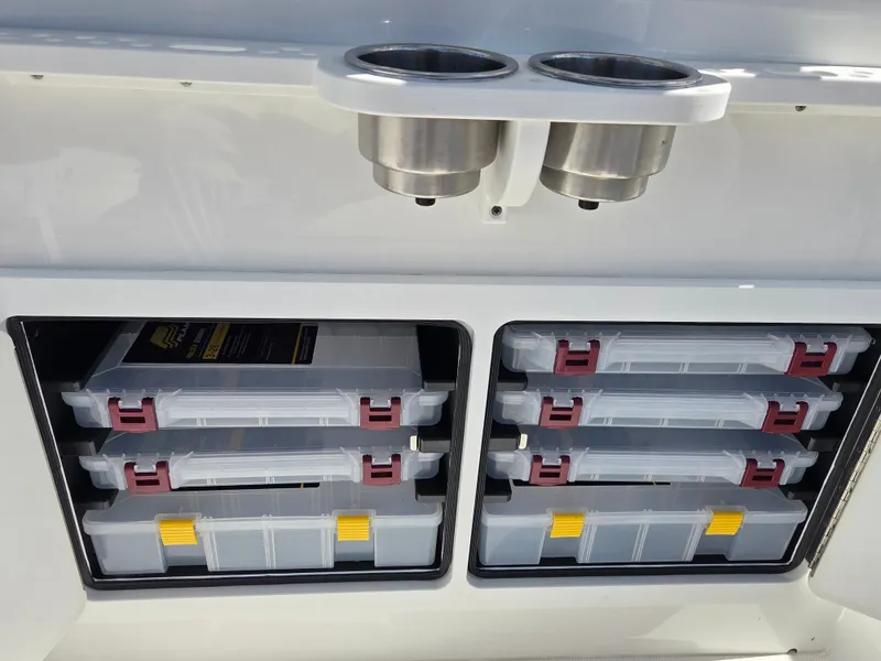 Slide: The Image of Fishing gear compartments with multiple storage boxes and two stainless steel cup holders. - 21