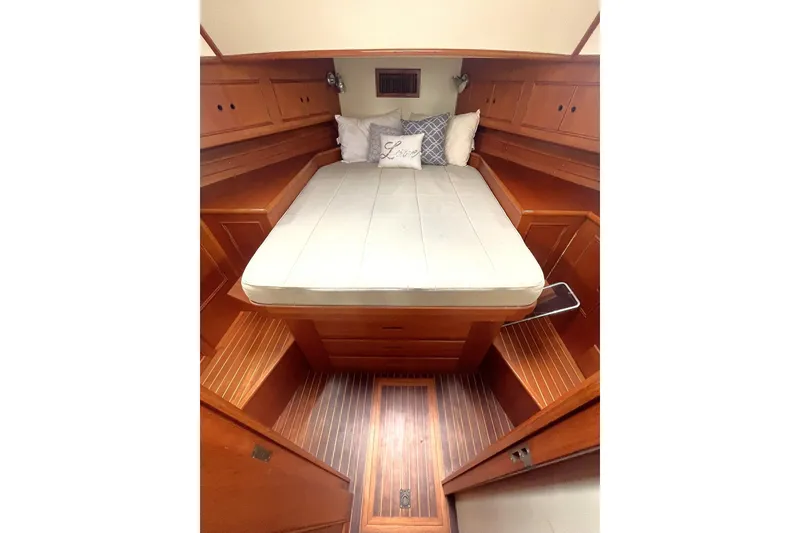Slide: The Image of MASTER STATEROOM QUEEN ISLAND BERTH, TEAK & HOLLY SOLE, WITH STEP UPS ON EACH SIDE. - 32