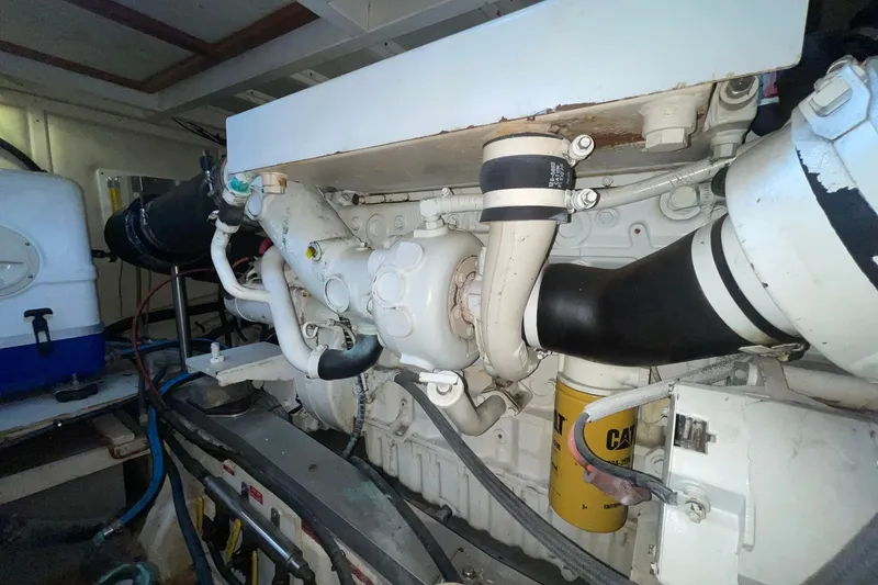 Slide: The Image of Engine room of 1998 Grand Banks 43 Eastbay FB with visible components and piping. - 56