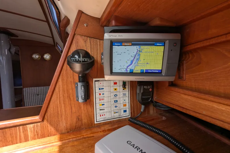 Slide: The Image of Navigation equipment on 1980 Sceptre 36 yacht, featuring Garmin GPS and compass. - 15