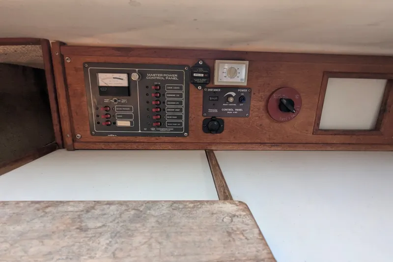 Slide: The Image of Control panel of a 1980 Sceptre Scepter 36 boat with various switches and gauges. - 17