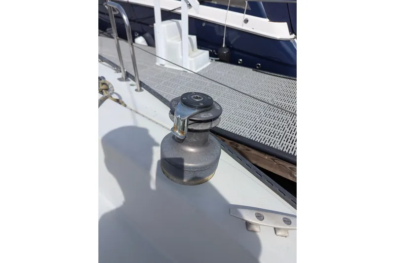 Slide: The Image of Winch on 1980 Sceptre 36 sailboat deck, with dock in background. - 13