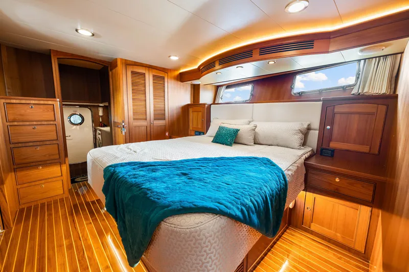 Slide: The Image of Luxurious cabin interior of 2017 Marlow Explorer 49E yacht with elegant wood finishes. - 43