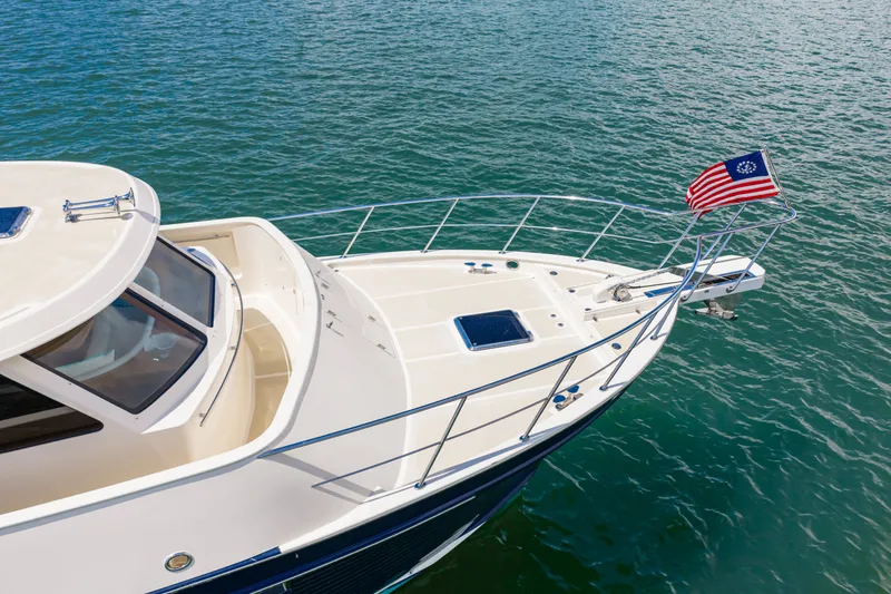 Slide: The Image of 2017 Marlow Explorer 49E yacht on water with American flag. - 23