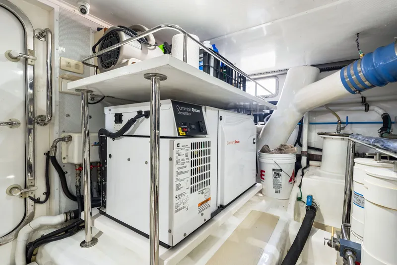 Slide: The Image of Engine room of 2017 Marlow Explorer 49E with Cummins Onan generator. - 51