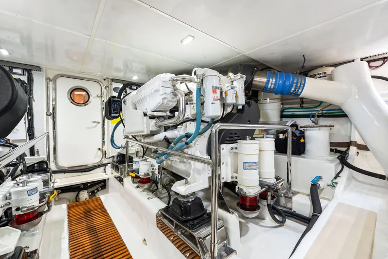 Slide: The Image of Engine room of 2017 Marlow Explorer 49E yacht, showcasing mechanical components and equipment. - 53