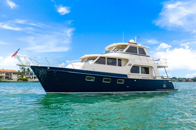Slide: The Image of 2017 Marlow Explorer 49E yacht on clear blue water under a bright sky. - 29