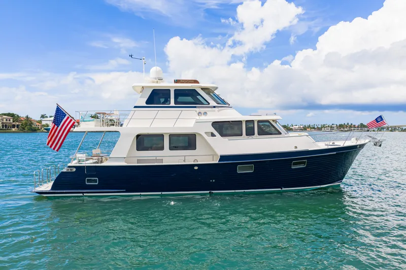 The Image of 2017 Marlow Explorer 49E yacht on clear blue water under a bright sky. - 0