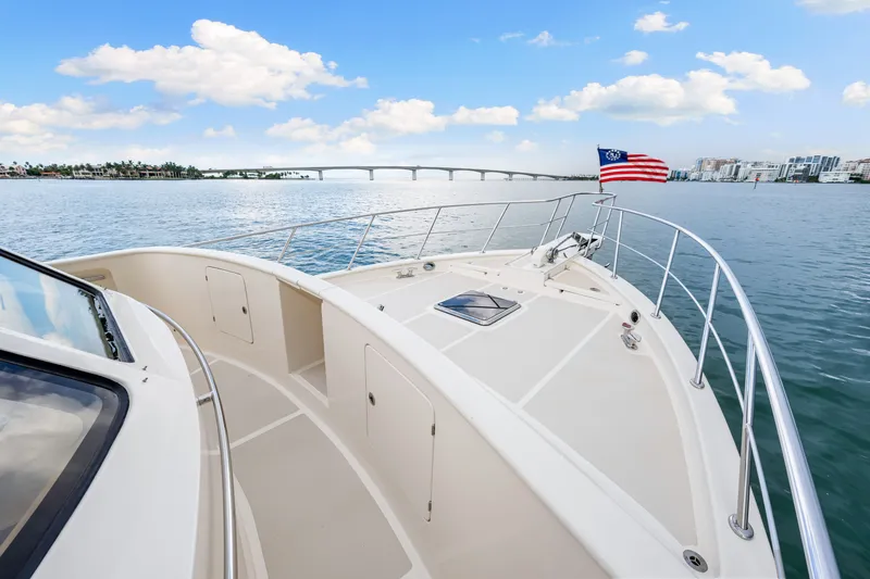 Slide: The Image of 2017 Marlow Explorer 49E yacht cruising with scenic bridge and city skyline. - 10
