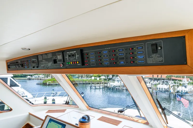 Slide: The Image of Control panel of 2017 Marlow Explorer 49E yacht with marina view. - 34