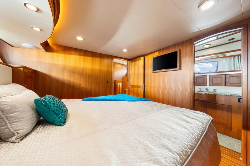 Slide: The Image of Luxurious cabin interior of 2017 Marlow Explorer 49E yacht with elegant wood finishes. - 44