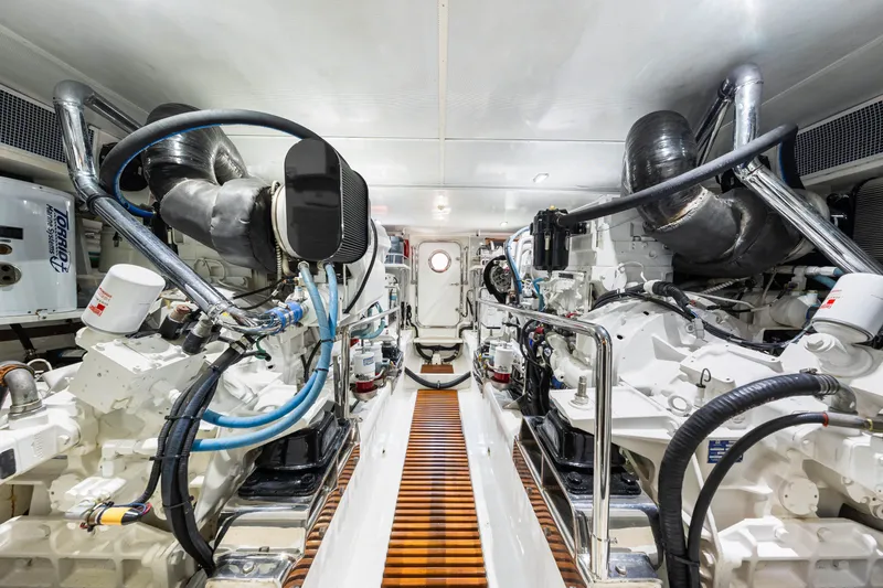 Slide: The Image of Engine room of 2017 Marlow Explorer 49E yacht, showcasing advanced machinery and piping. - 55
