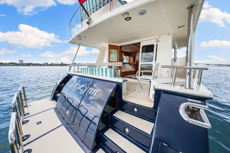 Slide: The Image of 2017 Marlow Explorer 49E yacht on water, featuring elegant deck and luxurious interior. - 20