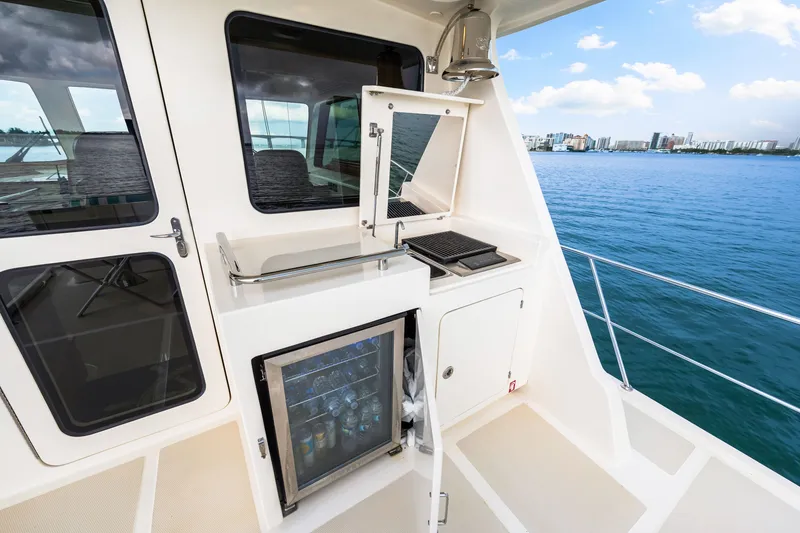 Slide: The Image of Outdoor kitchen on 2017 Marlow Explorer 49E yacht with ocean view. - 14