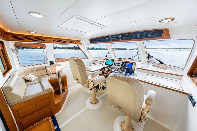 Slide: The Image of Luxurious 2017 Marlow Explorer 49E yacht interior with helm, seating, and panoramic windows. - 30