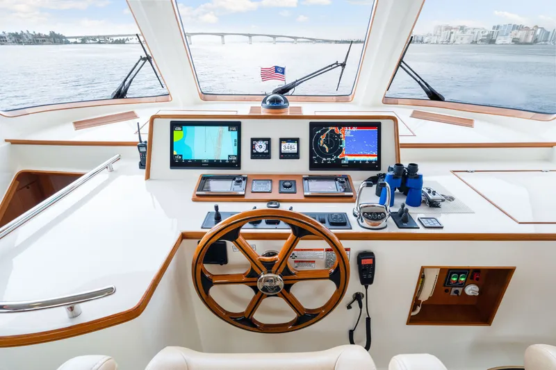 Slide: The Image of Helm of 2017 Marlow Explorer 49E yacht with navigation equipment and scenic view. - 32
